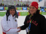 Canadian Coach Max Thompson congratulates Team Germany's Coach following the Team Jumping event in Seefeld