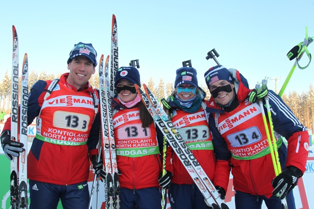 Jay Hakkinen, Sara Studebaker, Annelies Cook, and Tim Burke pose after their sixth-place World Cup mixed relay result in Kontiolahti, Finland om 2012. (Photo: NordicFocus/USBA.)