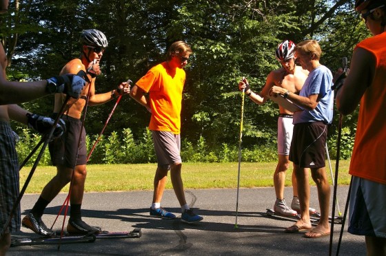 Gus Kaeding (in orange) and SMS program director Sverre Caldwell (in blue) meet with several senior skiers and older juniors during a double-pole workout near Stratton, Vt. Elite-team members Skyler Davis (left) and Eric Packer (third from right) check in.