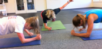 Stratton Mountain School (SMS) T2 teammates Erika Flowers (l), Jessie Diggins (c) and Sophie Caldwell doing some planks in the SMS weight room on July 12. It was Diggins' first training session with the team since moving from the Midwest.