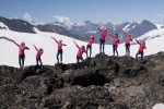 Sadie Bjornsen (fourth from right) and her APU women's teammates pose like Jamaican sprinter Usain Bolt for a team photo on Eagle Glacier near Anchorage, Alaska. (Photo by Chris Hodel)