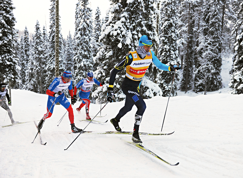 Alexey Poltoranin (KAZ), Alexander Legkov (RUS) and Maxim Vylegzhanin (RUS) chase Northug during the men's pursuit in Kuusamo (FIN).  Photo: Fischer/Nordic Focus.