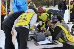 Race officials converge on a timing laptop at SuperTour races in Bozeman, Montana, earlier this season as they try to iron out problems in the results from a classic sprint qualifier.