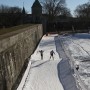 Skiers navigate 'the ledge' on the backstretch. thumbnail