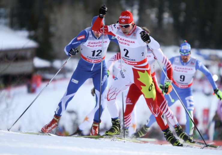 Canadian Jesse Cockney of the Alberta World Cup Academy and Senior Development Team (2) leads Finland's Anssi Pentsinen (12) and the rest of his quarterfinal in Saturday's World Cup 1.3 k skate sprint in Canmore, Alberta. Cockney won the heat and went on to place ninth overall for a personal best in his fifth World Cup start.