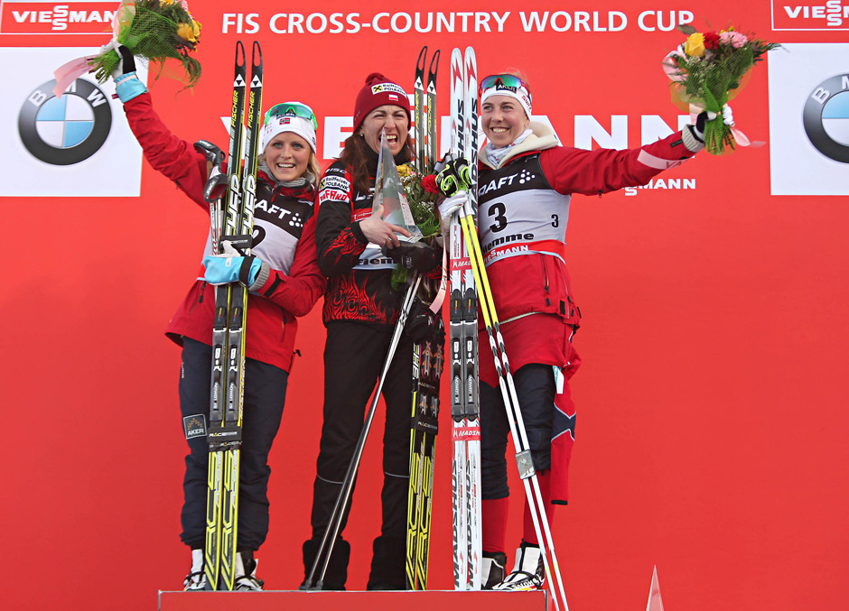 The 2012/2013 Tour de Ski women's podium, with winner Justyna Kowalczyk (c) of Poland; Norwegian runner-up Therese Johaug (l) and Norway's Kristin Størmer Steira in third. (Photo: Fiemme2013)