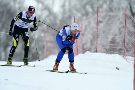 Annie Pokorny following a Czech skier in the classic part of the skiathlon. Photo: Liberec2013.