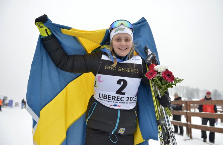 Stina Nilsson (SWE) celebrates her victory in the women's classic sprint at World Junior Championships in Liberec, Czech Republic. Photo: Liberec2013.