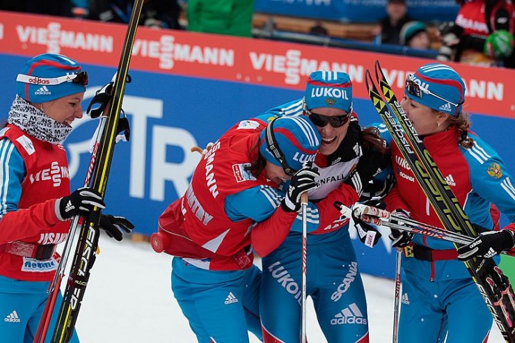 Russia's 4 x 5 k relay congratulates anchor Yulia Tchekaleva, who lifted the team to third on Thursday at the 2013 World Championships in Val di Fiemme, Italy. (Photo: Fiemme2013)