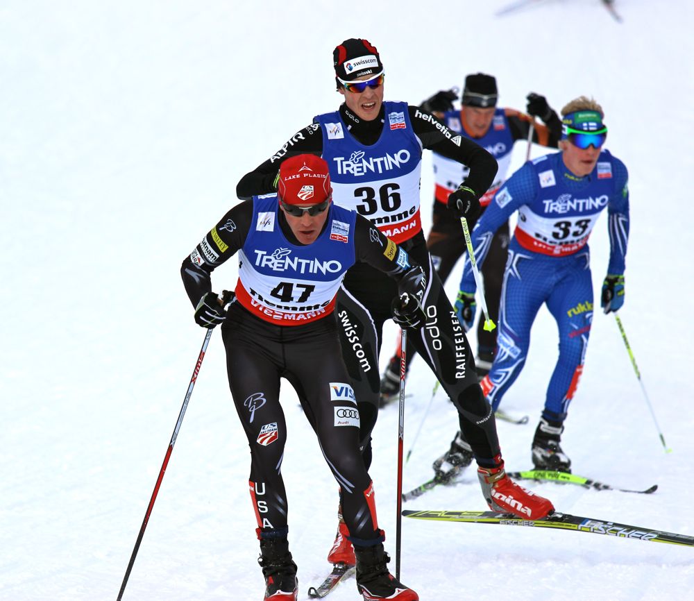 American Billy Demong leads Tim Hug (SUI) and the rest of a chase group on the second to last lap behind the leaders of Friday's 10 k Gundersen at World Championships in Val di Fiemme, Italy. 