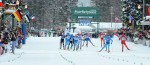 Fabio Santus (right, in blue), leads the men's 2013 American Birkebeiner field to the finish line in Hayward, Wisconsin. Santus was second; his teammate Sergio Bonaldi (far left in blue) won the race. Photo, Darlene Prios/American Birkebeiner Ski Foundation