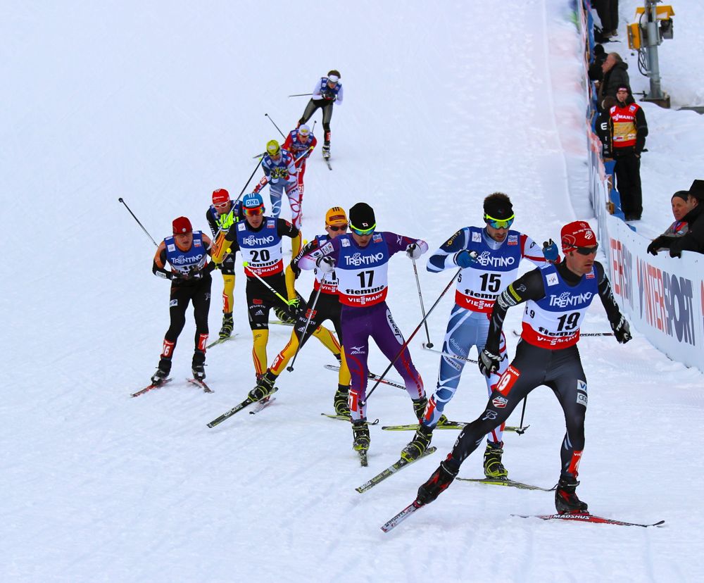 Bryan Fletcher (USA) leads a pack in the third of four laps during the 10 k Gundersen start at the 2013 World Championships in Val di Fiemme. After placing 19th on the normal hill in Predazzo, Italy, Fletcher rose to 14th overall at the Lago di Tesero stadium in Val di Fiemme.