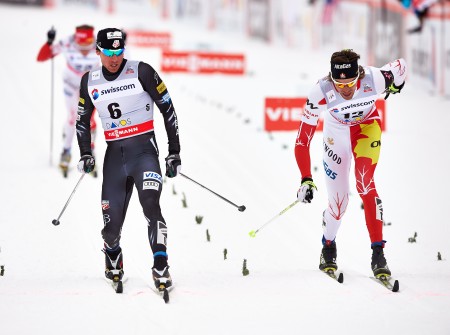 American Andy Newell (l) captures second in a World Cup semifinal just 0.25 seconds ahead of Canada's Lenny Valjas in the 1.5 k classic sprint at the Davos World Cup in Switzerland 2013. (Photo: Fischer/Nordic Focus)