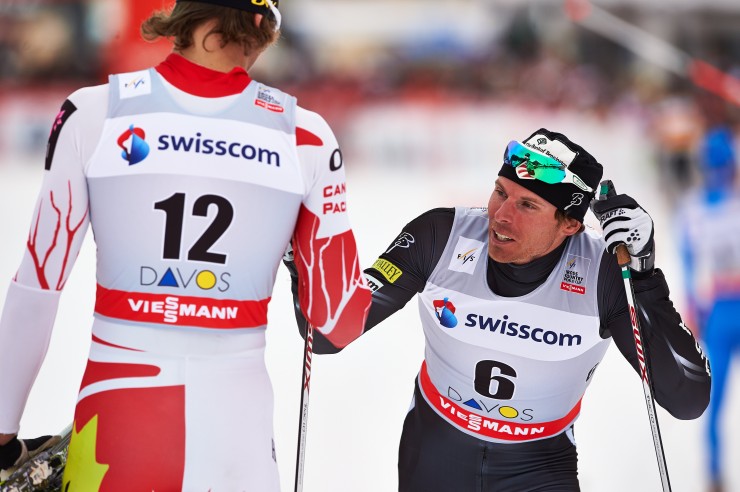 US Ski Team member Andy Newell (6) checks in with Canadian Lenny Valjas after the World Cup classic sprint final on Saturday in Davos, Switzerland. Newell was fourth for his best result in more than two years, and Valjas placed sixth. (Photo: Fischer/Nordic Focus)