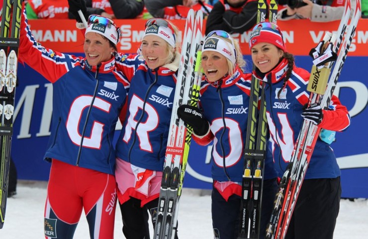 Thursday's 4 x 5 k relay winners (from left to right), Marit Bjorgen, Kristin Stormer Steira, Therese Johaug and Heidi Weng celebrate their second-straight title at World Championships. The topped Sweden by 26.2 seconds for the victory in Val di Fiemme, Italy, but had a little difficulty spelling out a tribute to Norway at the finish.