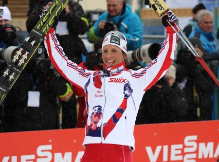 Bjørgen relishes her victory for the cameras.