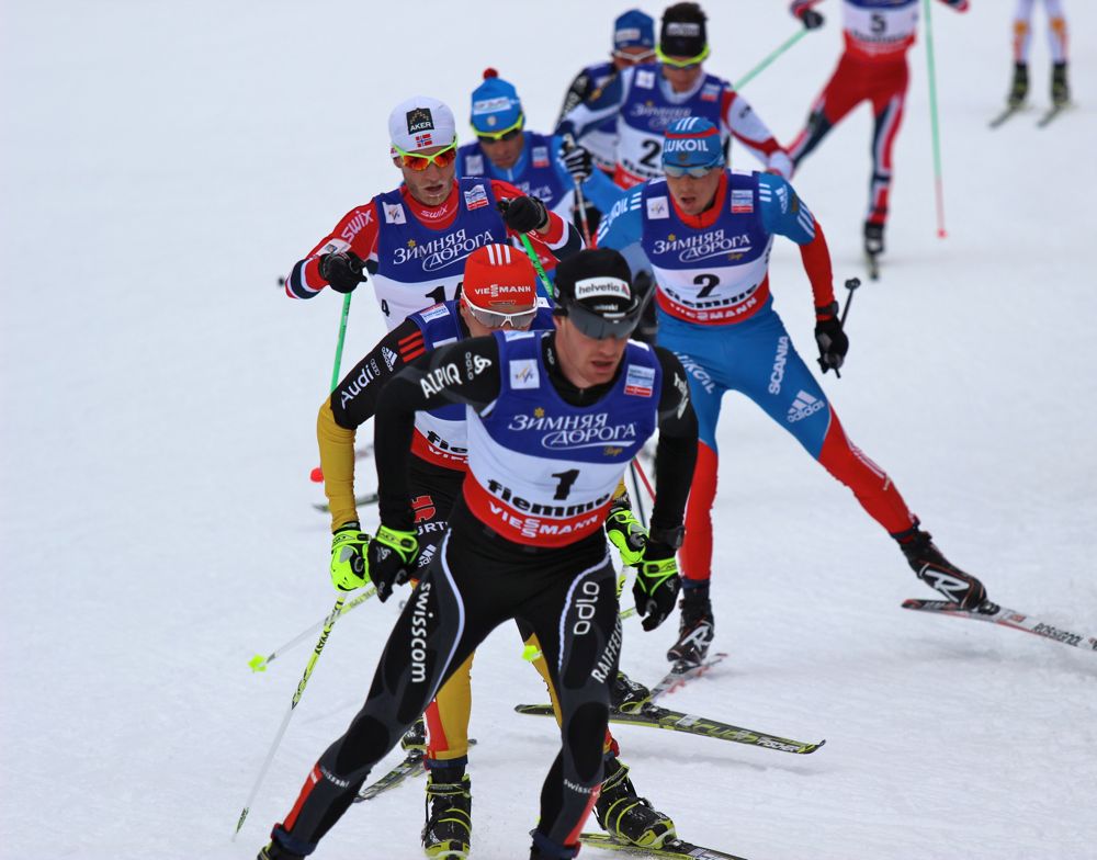 Switzerland's Dario Cologna leads Tobias Angerer of Germany, Russia's Alexander Legkov and nearly 20 others during the skate portion of Saturday's 30 k skiathlon at the 2013 World Championships in Val di Fiemme, Italy. Cologna went on to win gold for his first medal at worlds.