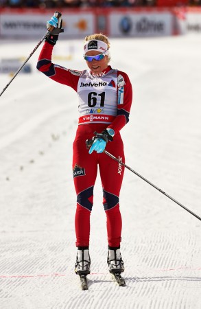 Therese Johaug (NOR) crosses the finish with the win in the ladies' 10k freestyle in Davos, Switzerland.  Photo: Fischer/Nordic Focus. 