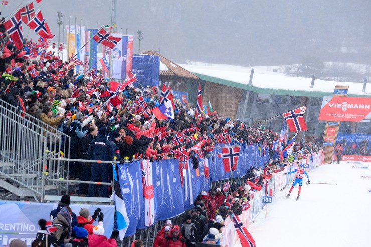 Russia's Nikita Kriukov high-fives a crew of proud Norwegian fans after edging their own Petter Northug in Thursday's 1.5 k classic sprint at World Championships in Val di Fiemme, Italy. (Photo: Fiemme2013)