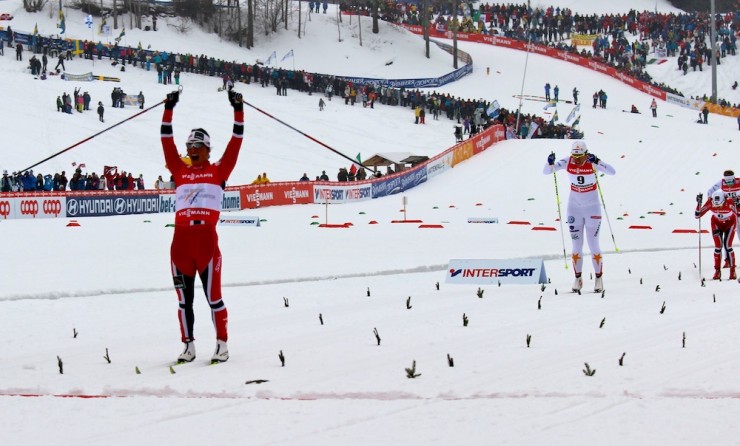 Marit Bjørgen (NOR) lets out a triumphant yell, arms raised, as she wins the classic sprint at World Championships in Val di Fiemme, Italy, on Thursday.