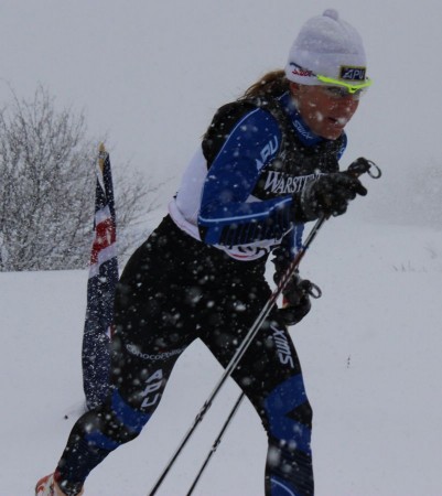 Rosie Brennan (APU) skiing to a sprint prologue win in dense snowfall.