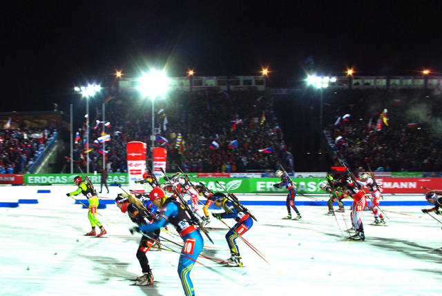 As Czech flags wave in the background, the mixed relay field sets off in pursuit of the first 2013 Biathlon World Championship title on Thursday in Nove Mesto, Czech Republic.