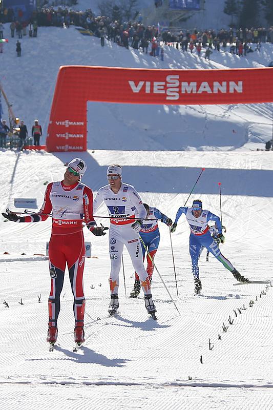 Petter Northug prematurely shrugs off Norway's seventh-straight men's relay title at World Championships on Friday in Val di Fiemme, Italy. He beat Sweden's Calle Halfvarsson (second from l), Russia's Sergey Ustiugov (third) and David Hofer of Italy in fourth for his second gold of the week. (Photo: Fiemme2013)