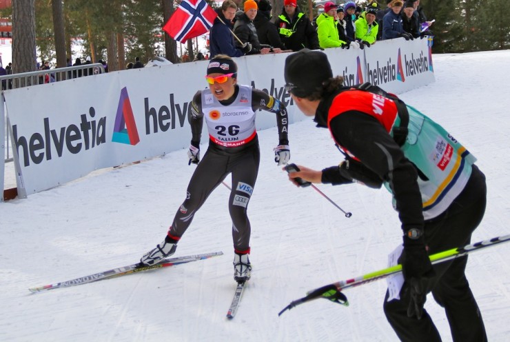 Matt Whitcomb (r) cheering on Holly Brooks during the 2.5 k freestyle prologue on Friday in Falun, Sweden. Photo: Bryan Fish.