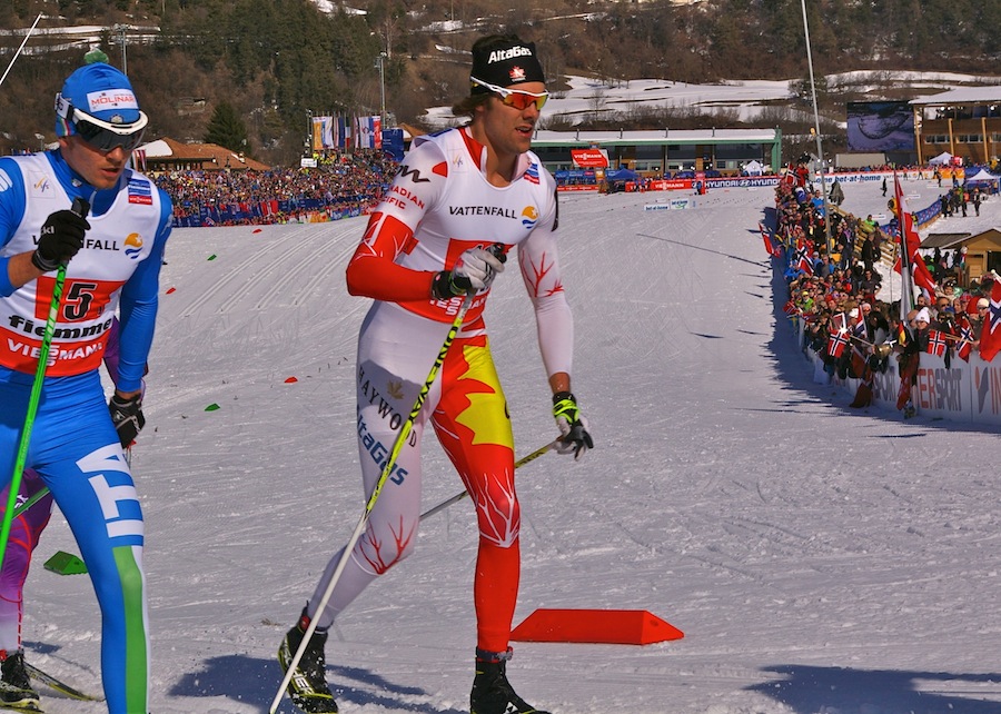 Lenny Valjas heads out of the stadium alongside Italy's Dietmar Nöckler on the first leg of Friday's 4 x 10 k relay at World Championships in Val di Fiemme, Italy.