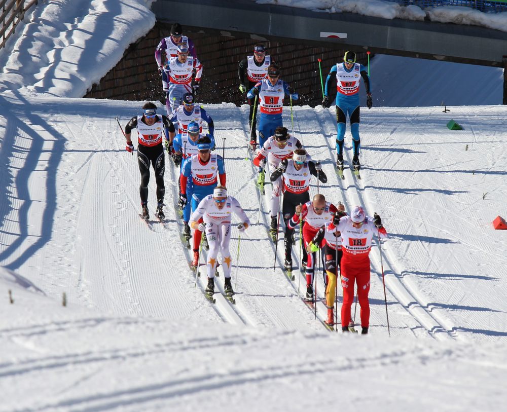 Norway's Torde Asle Gjerdalen (r) puts the team in contention early on the first of four 10-kilometer legs in Friday's relay at 2013 World Championships in Val di Fiemme, Italy. Norway won by 1.2 seconds over Sweden.