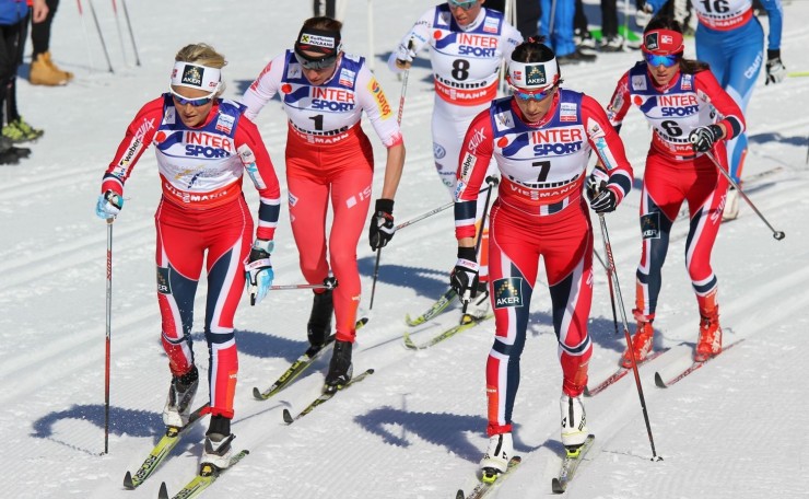 A sea of red: Three Norwegians and Poland's Justyna Kowalczyk (second from l) lead early in Saturday's 30 k classic mass start at the 2013 World Championships. Therese Johaug (l) and eventual-winner Marit Bjørgen work up fron, followed by Heidi Weng (r) and Sweden's Charlotte Kalla (8).