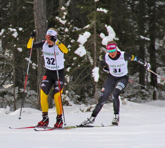 Sandra Ringwald (GER) and Sadie Bjornsen (USA) skied a closely-fought 10 k pursuit on Sunday to wrap up OPA Cup Finals in Toblach, Italy. Bjornsen took second place by 1.0 seconds. Photo: Bryan Fish.