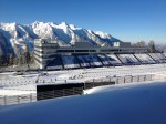 The new biathlon stadium and buildings in Sochi have been called the biggest anywhere; though the 11,000 people that the stadium can hold is fewer than some other venues, the five-story glass-and-steel building housing working space and permanent offices dwarfs anything else on the circuit. Photo: Max Cobb.