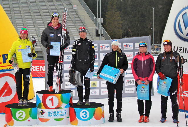 Kate Fitzgerald, Sophie Caldwell, and Rosie Brennan standing on the podium that held biathlon World Champions in Nove Mesto just a few weeks ago; Becca Rorabaugh also made the top six in Sunday's Slavic Cup. Photo: Bryan Fish courtesy of Kate Fitzgerald.