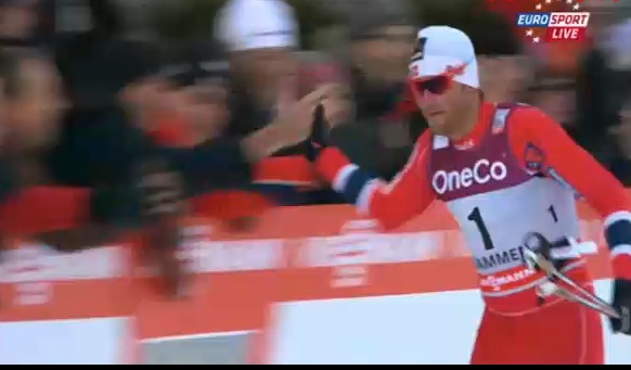Showing his softer side, Northug high-fives crowd after classic-sprint victory in Drammen, Norway.
