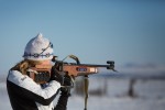 U.S. national team biathlete Hannah Dreissigacker demos her sport for kids in a village in the Alaskan Arctic. Photo: Brendan Smith/ANTHC.