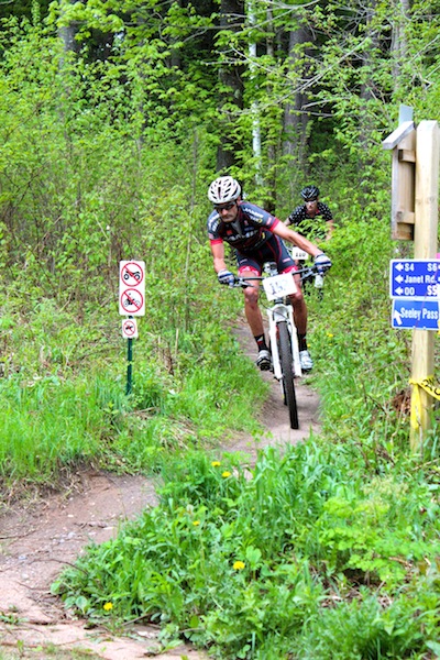 Jason Sager (champion) leads Jesse Lalonde (2nd overall) through the Seeley Pass trail.