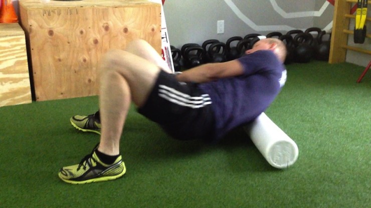 Author Stuart Kremzner demonstrates one way to use a foam roller to work out the kinks along the spine and back. 