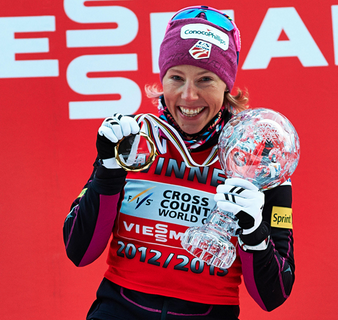 Kikkan Randall (USA) wins her second straight FIS Sprint Crystal Globe on Randall showing off her 2013 Sprint Cup globe.(Photo: Fischer/Nordic Focus)