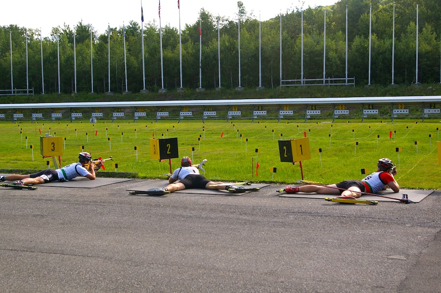 Eventual men's winner Lowell Bailey (c) gets his shooting on Aug. 11 at the Ethan Allen Firing Range in Jericho, Vt. Bailey went on to win the two-day North American Biathlon Rollerski Championships.