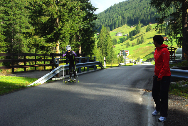 Swiss national team coach Guri Hetland checks Team Coop's Seraina Boner's time on a threshold interval on Wednesday.