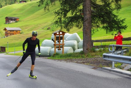 Swiss head coach Guri Hetland takes video of Dario Cologna during a threshold workout.