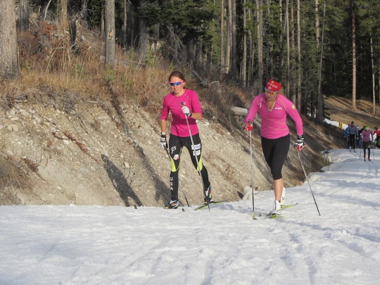 Chandra Crawford (r) skis alongside Sophie Caldwell of the U.S. Ski Team at Frozen Thunder in Canmore, Alberta, in October.