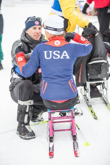 John Farra, high-performance director of the U.S. Paralympics Nordic Program, helps one of his athletes at last year's IPC World Cup in Cable, Wis. (Photo: James Netz)