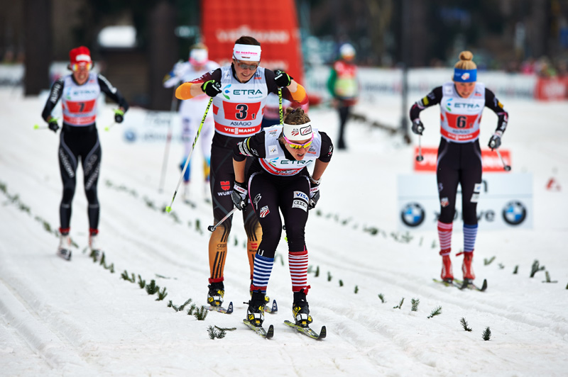 Fellow US Ski Team members Sadie Bjornsen (front) and Ida Sargent (r) go head to head in Sunday’s 1.25 k classic team sprint final at the World Cup in Asiago, Italy. Katrin Zeller of Germany (7) chases Bjornsen. (Photo: Fischer/Nordic Focus)