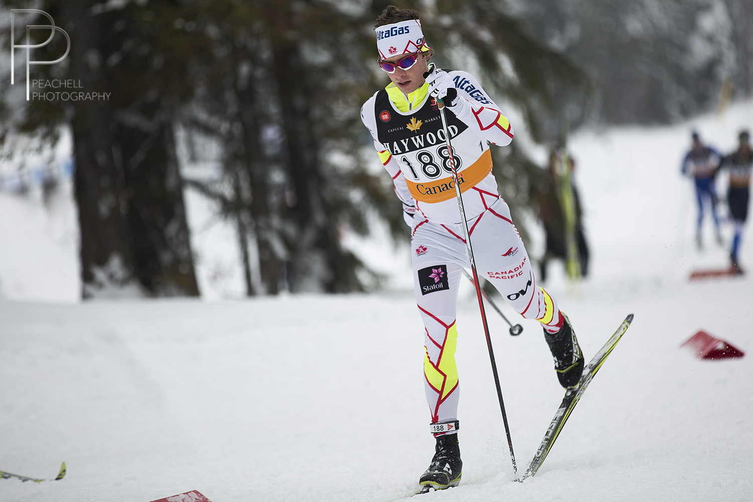 Kevin Sandau (AWCA/NST) racing to victory in the NorAm 15 k classic individual start on Dec. 15 in Rossland, B.C.  (Photo: Shelley Peachell/Peachell Photography, http://peachellphotography.com/)