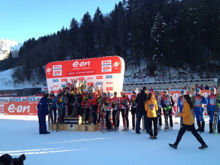 The top teams in the 4 x 6 k women's relay gather around the podium Thursday at the IBU World Cup in Annency, France. Germany won, Ukraine was second, Norway placed third, and Canada notched a historic fourth. (Photo: Biathlon Canada/Matthias Ahrens)
