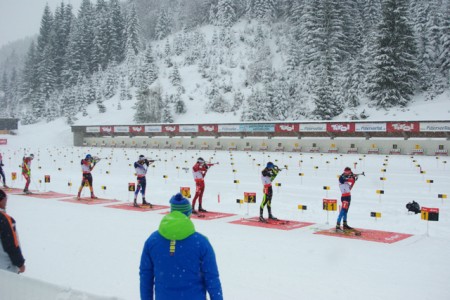 Ole Einar Bjørndalen, center in red, on the range en route to moving Norway into the lead.