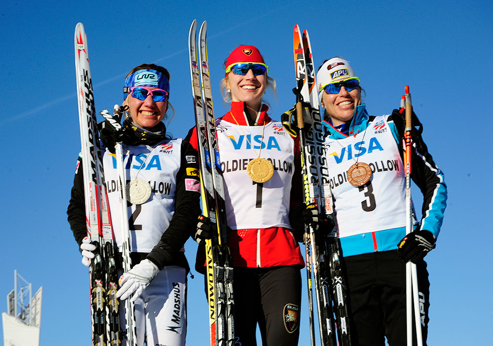 The women's 1.5 k freestyle sprint podium, with winning Jennie Bender (c) of the Bridger Ski Foundation, Caitlin Gregg (l) of Team Gregg/Madshus in second, and Rosie Brennan (APU) in third. (Photo: Tom Kelly/USSA)