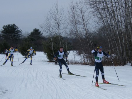 Multiple laps means multiple packs: Middlebury teammates Ben Lustgarten (71) and Patrick McElravey (41) ski together. UMPI teammates Zach Veayo (16) and Andrew Nesbitt (53) follow